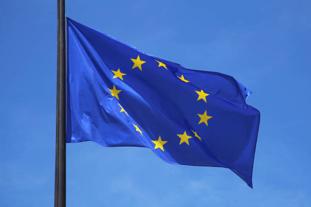 European union flag with blue sky background.