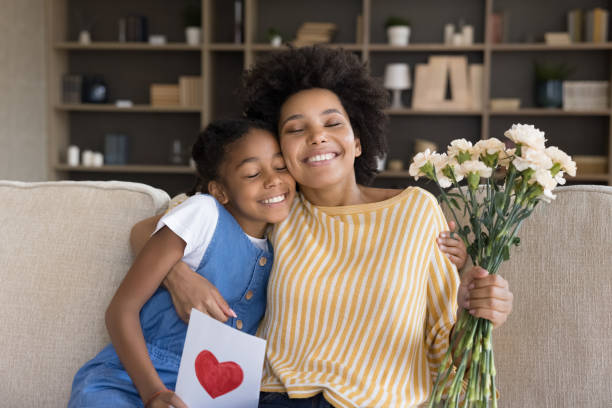istock Happy grateful Black mom hugging daughter kid with love 1368613392