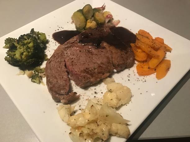 istock Lunch Dinner - Steak Carrots Broccoli Cauliflower Brussels sprouts Sauce Gravy 1368614504