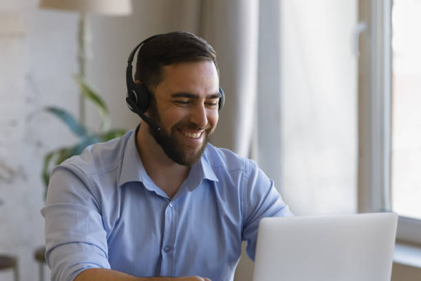 istock Happy young man holding video call conversation. 1368614985