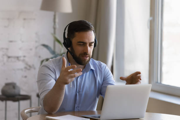 istock Happy smart young businessman communicating by video call. 1368615010