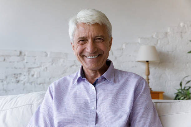 istock Portrait of smiling handsome old retired man. 1368615108