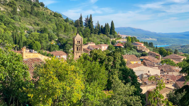Village of Moustier Sainte Marie in Provence, France Village of Moustier Sainte Marie in Provence, France with a view on the bell tower of the Notre-Dame-de-l'Assomption church sainte marie stock pictures, royalty-free photos & images