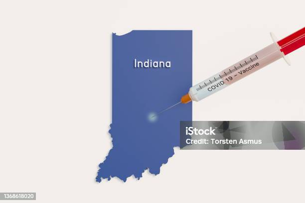Us State Indiana And A Covid 19 Syringe As Symbol For Vaccination Of People In The State Indiana Stock Photo - Download Image Now