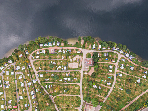Aerial view of Longemer lake camping resort next to the lake water, Voges, France
