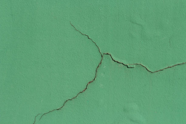 istock Trendy green color cracked background 1368620837