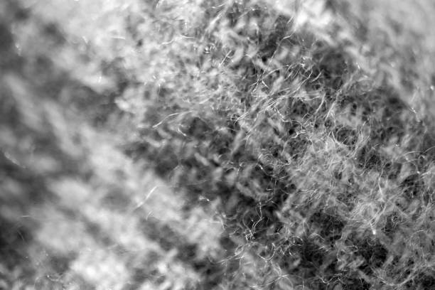 istock dough preparation, flour sifting. close-up. 1368621032