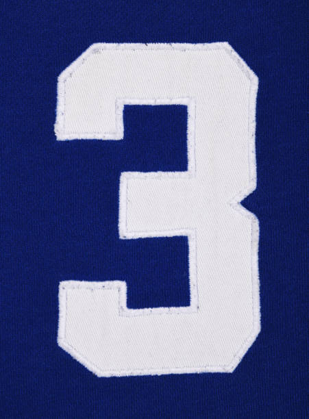 istock The number three 3 is embroidered with white threads on blue fabric. 1368623030