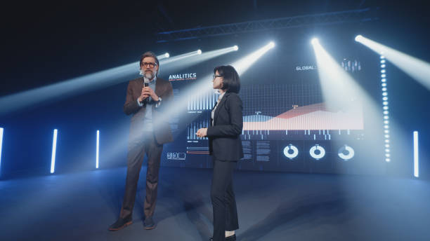 istock Businessman explaining charts to female host 1368625854