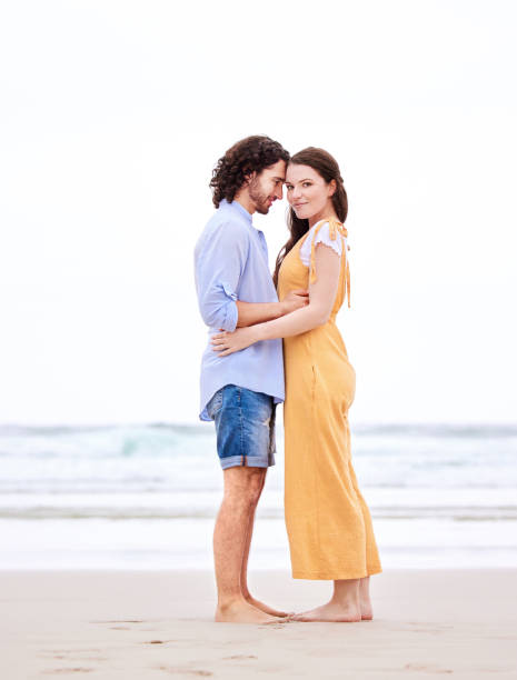istock Shot of an affectionate couple spending time together at the beach 1368626099
