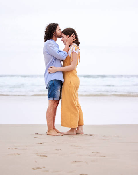 Shot of an affectionate couple spending time together at the beach