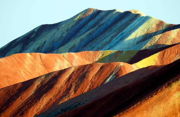 Mountain of Colors, Zhangye Danxia National Geological Park in the Gobi Desert, China zhangye,mountain,travel,nature,peopleless,danxia topography,hill,geology,non-urban landscape,sandstone,scenic landscape,tourist destinations,zhangye national geopark,natural park,rock,mountain range,place of interest,backgrounds,beauty of nature,dry,land feature,topography,zenith view,gobi desert,valley,desert,canyon - valley type danxia landform stock pictures, royalty-free photos & images