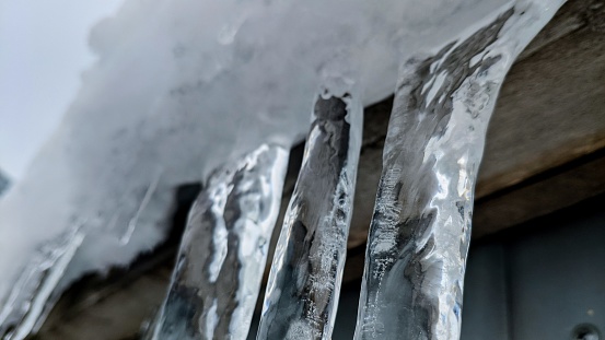 Hanging icicles close up in winter