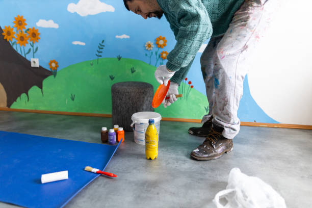 istock Caucasian male artist preparing the painting tools for work 1368632138
