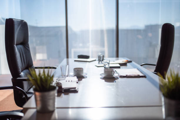 Empty business meeting room with chairs in a row