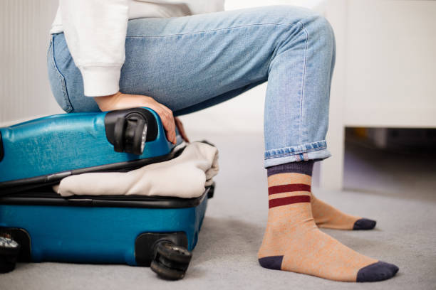 istock Preparation travel suitcase at home 1368636202