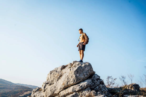 istock Sporty man high on mountain 1368637717