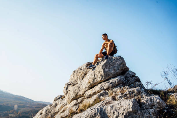 istock Sporty man high on mountain 1368637851