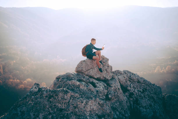 istock Sporty man high on mountain 1368637888
