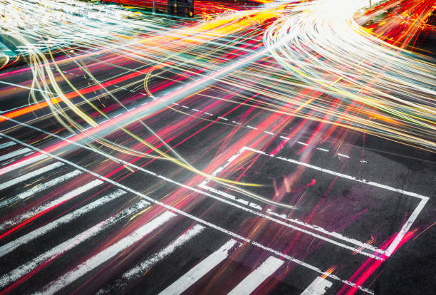 istock Night traffic trails at busy crossing 1368638281