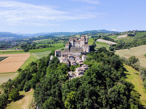 Aerial view and surrounding landscape of the Castle of Torrechiara close to Parma in Emilia Romagna in Italy. Torrechiara - Italy - June 23 2020