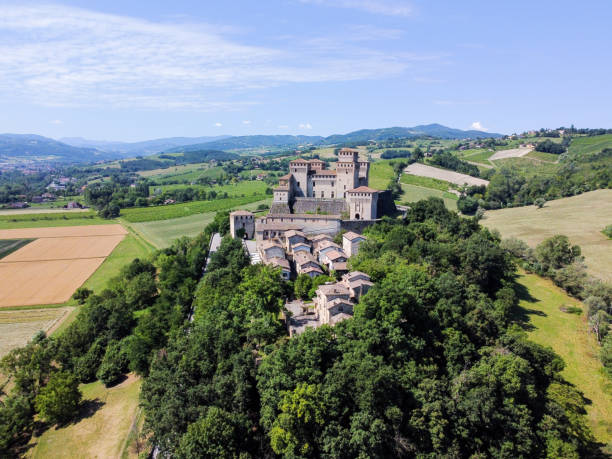 The castle of Torrechiara from drone Aerial view and surrounding landscape of the Castle of Torrechiara close to Parma in Emilia Romagna in Italy. Torrechiara - Italy - June 23 2020 parma italy stock pictures, royalty-free photos & images