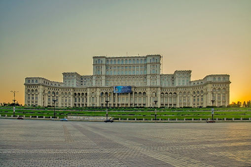 Romania - Bucharest - The giant structure of palace of the parliament aka republic's house or people's house on the sunset. The heaviest and one of the biggest buildings in the world
