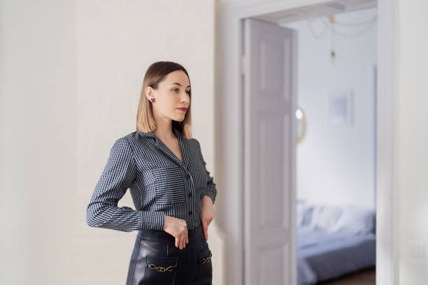 istock Lovely woman looking at her in the mirror 1368641138