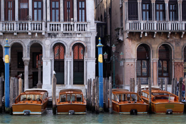 Venice is a city in northeastern Italy sited on a group of 117 small islands separated by canals and linked by bridges.