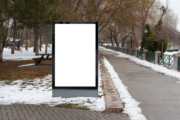 istock Blank billboard in snowy weather in a public park 1368643256