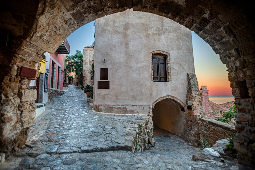 Early morning in Monemvasia through an arch, Greece