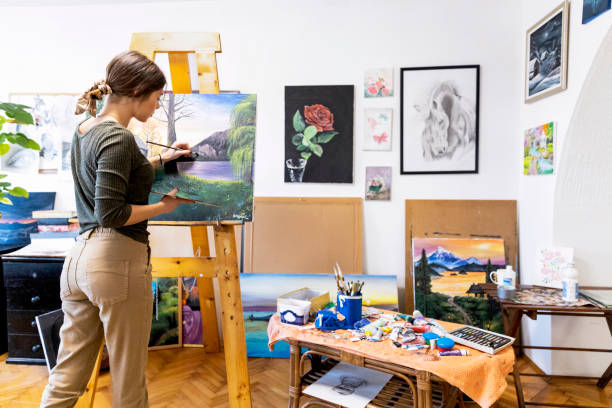 istock Young painter creates in her studio at home stock photo 1368647443