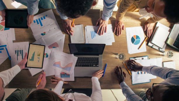 istock Business colleagues having a meeting, reviewing and discussing data on documents 1368649265
