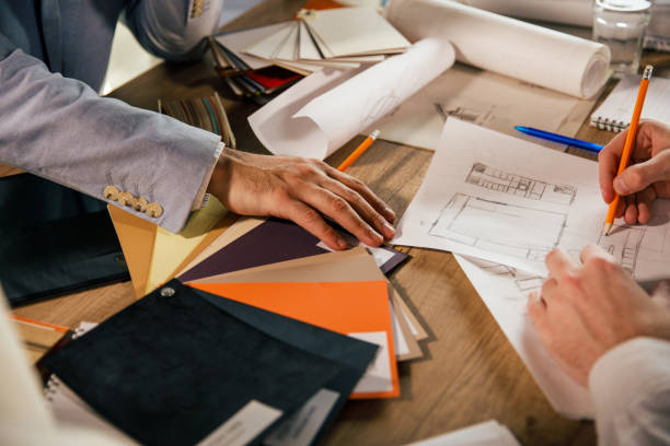 istock Architects making a sketch for interior design they are co-working on 1368650248