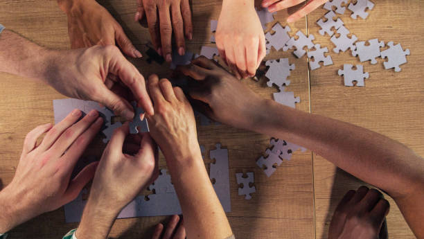 istock All working as one when arranging jigsaw puzzle pieces together 1368650582