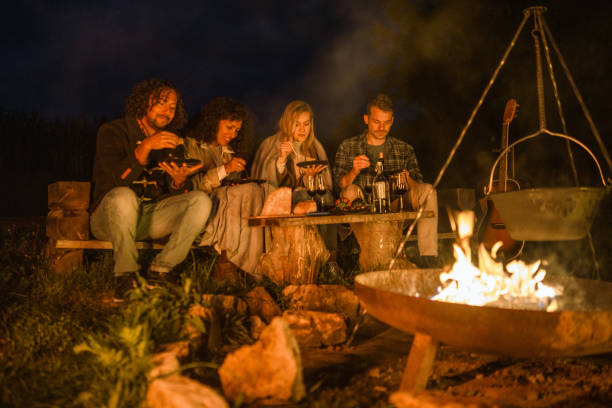 istock Mixed Race Friends Camping Together In Nature 1368650776