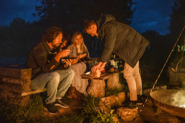 istock Mixed Race Friends Camping Together In Nature 1368650801