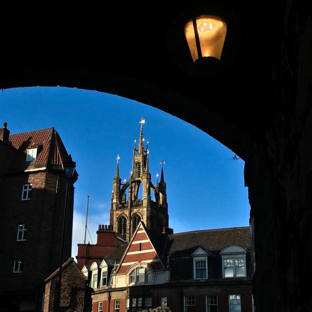 St Nicholas Cathedral Newcastle upon Tyne with Black Gate in foreground, viewed from beneath Victorian railway viaduct