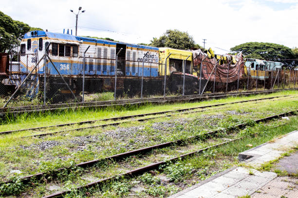 Abandoned train at the historical train station in Palmira City at the region of the Valle del Cauca in Colombia PALMIRA, COLOMBIA - SEPTEMBER, 2021: Abandoned train at the historical train station in Palmira City at the region of the Valle del Cauca in Colombia palmira colombia stock pictures, royalty-free photos & images