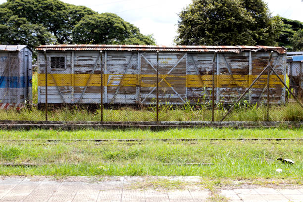 Abandoned train at the historical train station in Palmira City at the region of the Valle del Cauca in Colombia PALMIRA, COLOMBIA - SEPTEMBER, 2021: Abandoned train at the historical train station in Palmira City at the region of the Valle del Cauca in Colombia palmira colombia stock pictures, royalty-free photos & images