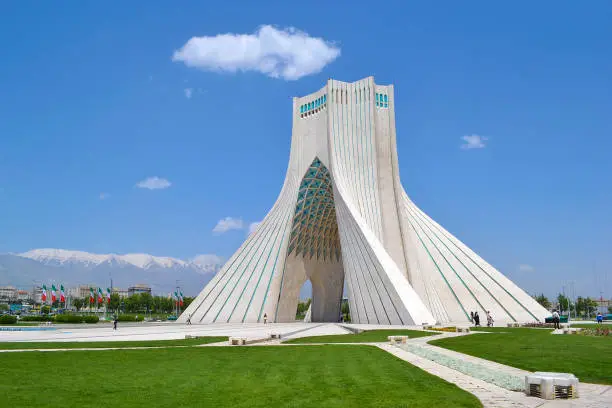 Azadi Monument, gate in Tehran, built to celebrate the Persian Empire, in the background the Elborz Mountains