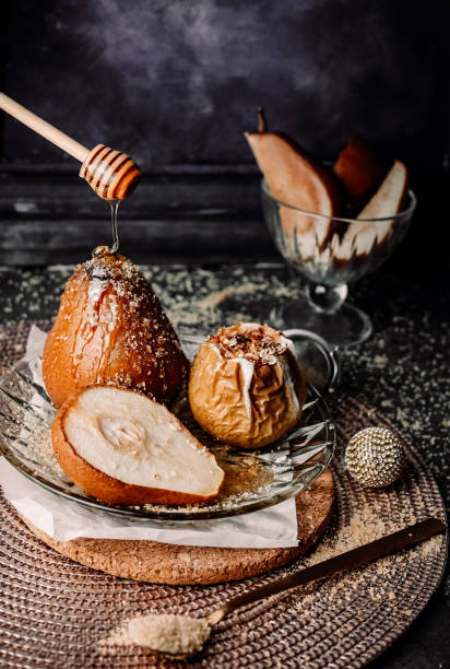 Baked pears on the dark background