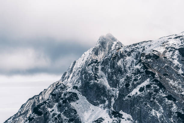 istock Snow-covered rocky mountain peak, Giewont, Tatra Mountains, Poland 1368656021