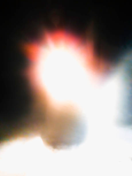 istock Abstract background image with glowing red and white lights on the black sky. Background image for mysterious, religious, or science fiction themes. 1368658829