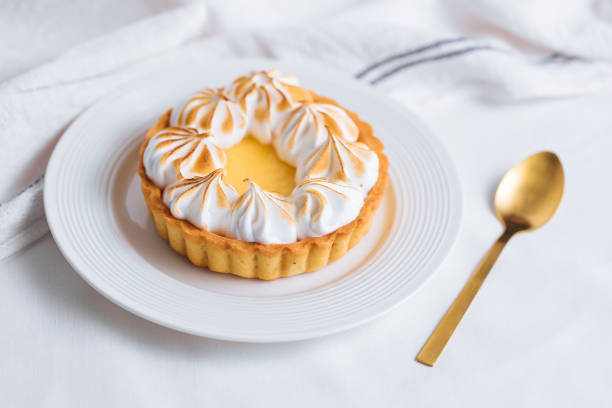 istock Lemon tart with wiped cream on top 1368658844