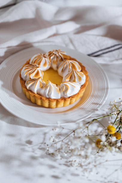 istock Lemon tart with wiped cream on top 1368658874