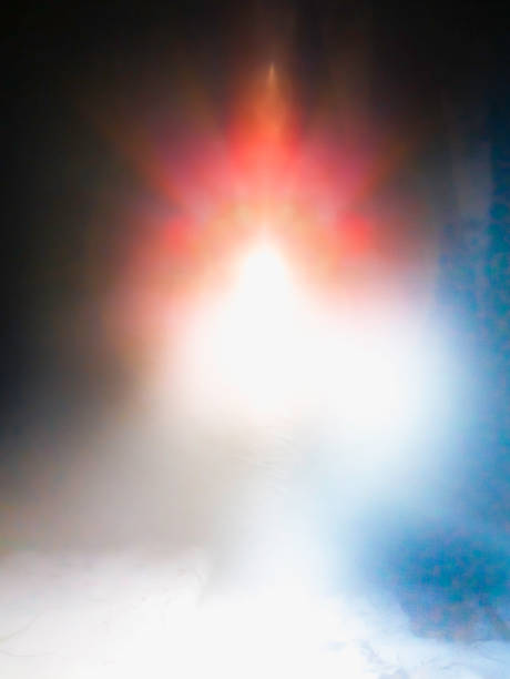 Abstract background image with glowing red and white lights soaring in the black sky. Background image for mysterious or space science themes.