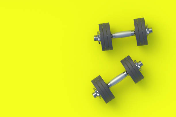 istock Dumbbells with heavy plates. Sports equipment. Copy space. Top view. 3d render 1368660464