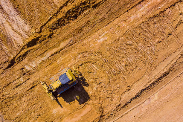 istock Grader is working on new building construction site with preparation of the land 1368662780