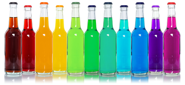 Drinks lemonade cola drink many softdrinks bottles in a row isolated on a white background